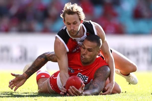 Lance Franklin of the Swans is tackled by Jimmy Webster of the Saints during the round 12 AFL match between the St Kilda Saints and the Sydney Swans...