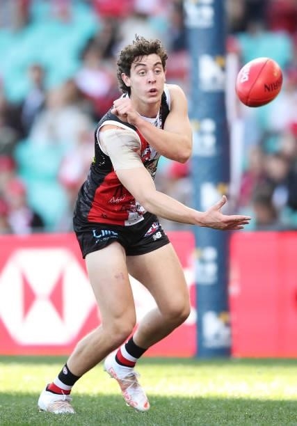 Nick Coffield of the Saints handballs during the round 12 AFL match between the St Kilda Saints and the Sydney Swans at Sydney Cricket Ground on June...
