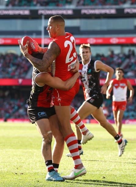 Lance Franklin of the Swans is tackled by Jack Steele of the Saints during the round 12 AFL match between the St Kilda Saints and the Sydney Swans at...
