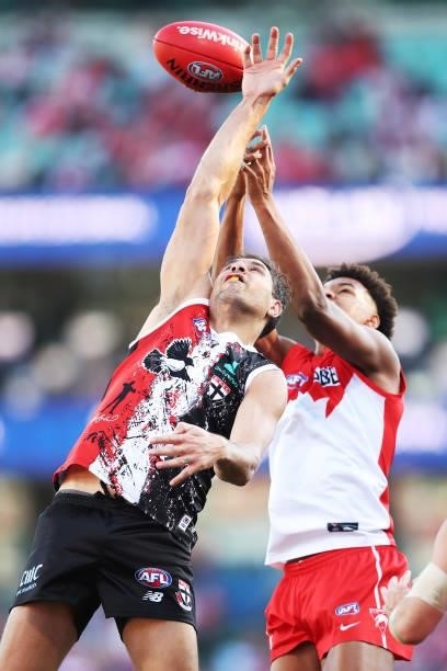 Paddy Ryder of the Saints is challenged by Joel Amartey of the Swans during the round 12 AFL match between the St Kilda Saints and the Sydney Swans...