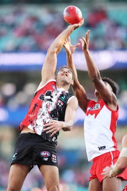 Paddy Ryder of the Saints is challenged by Joel Amartey of the Swans during the round 12 AFL match between the St Kilda Saints and the Sydney Swans...
