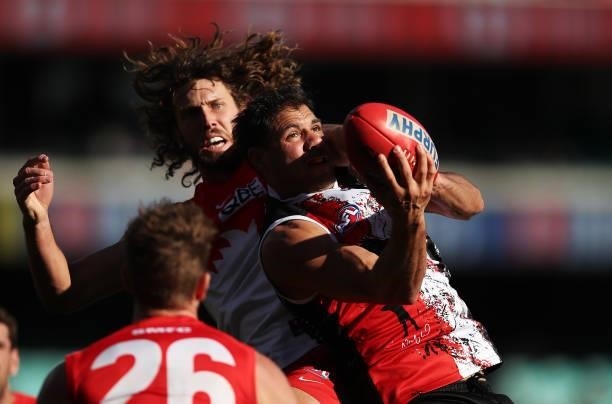 Paddy Ryder of the Saints is challenged by Tom Hickey of the Swans during the round 12 AFL match between the St Kilda Saints and the Sydney Swans at...