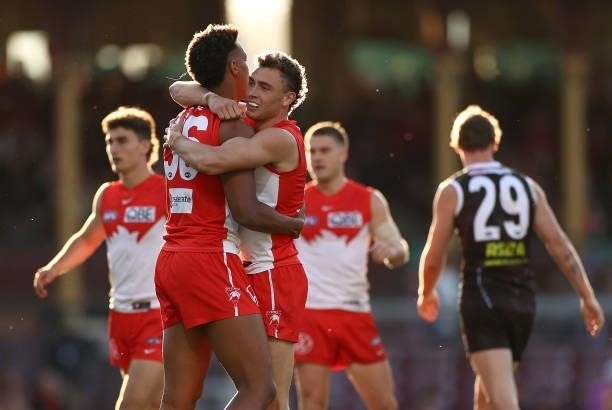 Will Hayward of the Swans is congratulated by team mates after kicking a goal during the round 12 AFL match between the St Kilda Saints and the...