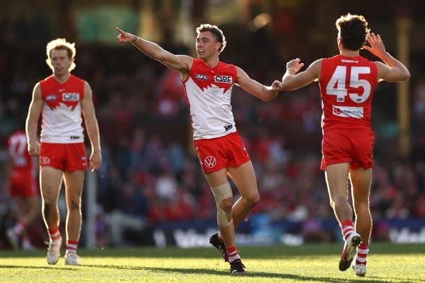 Will Hayward of the Swans is congratulated by team mates after kicking a goal during the round 12 AFL match between the St Kilda Saints and the...