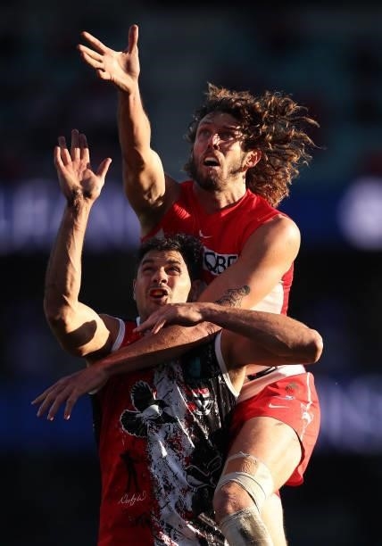 Tom Hickey of the Swans competes for the ball against Paddy Ryder of the Saints during the round 12 AFL match between the St Kilda Saints and the...