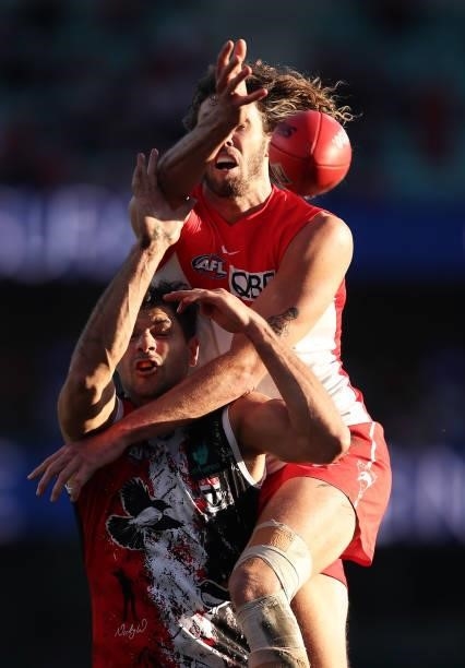 Tom Hickey of the Swans competes for the ball against Paddy Ryder of the Saints during the round 12 AFL match between the St Kilda Saints and the...