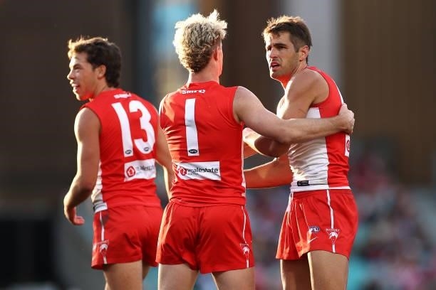 Josh P. Kennedy of the Swans is congratulated by team mates after kicking a goal during the round 12 AFL match between the St Kilda Saints and the...