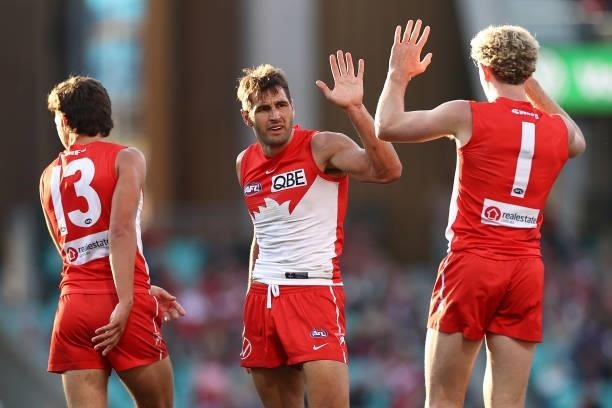 Josh P. Kennedy of the Swans is congratulated by team mates after kicking a goal during the round 12 AFL match between the St Kilda Saints and the...