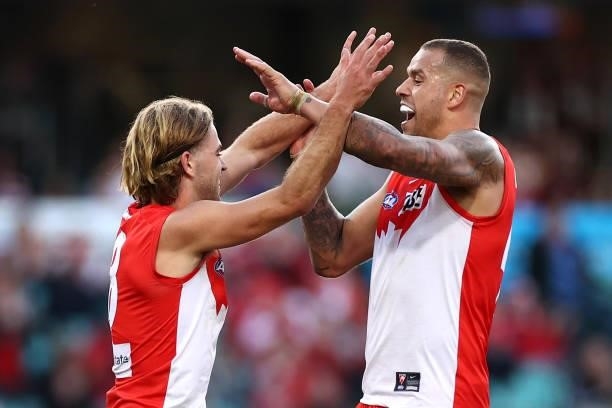 James Rowbottom of the Swans is congratulated by Lance Franklin after kicking a goal during the round 12 AFL match between the St Kilda Saints and...