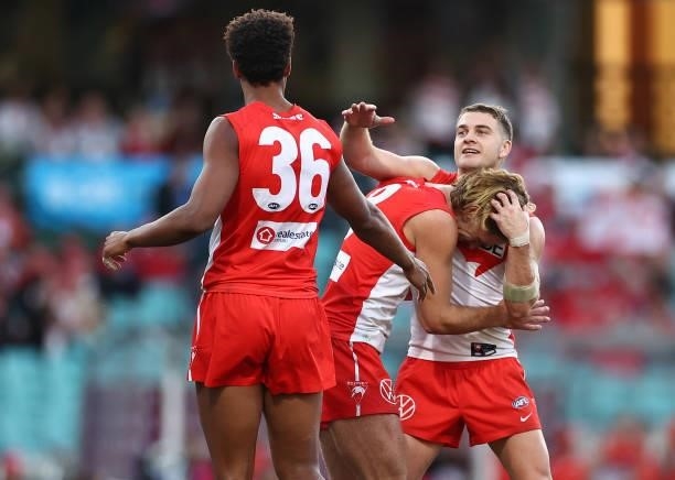 James Rowbottom of the Swans is congratulated by team mates after kicking a goal during the round 12 AFL match between the St Kilda Saints and the...