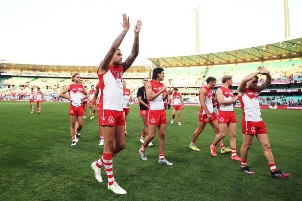 Lance Franklin of the Swans celebrates victory with team mates after the round 12 AFL match between the St Kilda Saints and the Sydney Swans at...