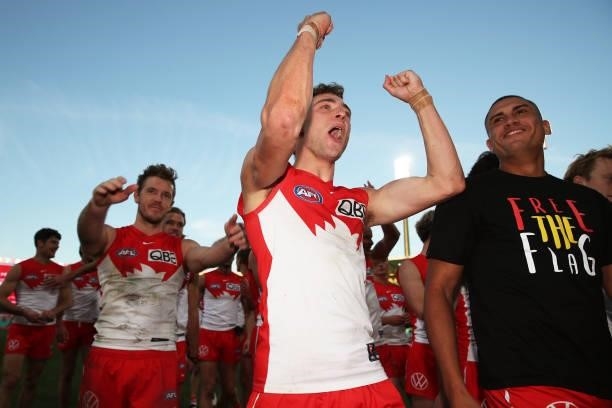 Will Hayward and James Bell of the Swans celebrate victory with team mates after the round 12 AFL match between the St Kilda Saints and the Sydney...
