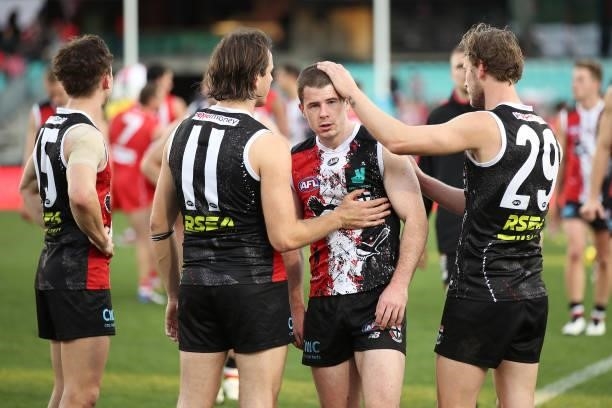 Jack Higgins of the Saints looks dejected with team mates after the round 12 AFL match between the St Kilda Saints and the Sydney Swans at Sydney...