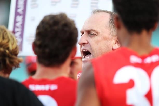 Swans head coach John Longmire speaks to players at three quarter time during the round 12 AFL match between the St Kilda Saints and the Sydney Swans...