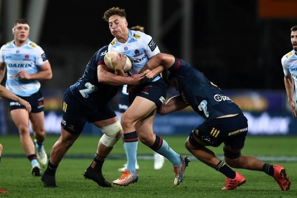 Mark Nawaqanitawase of the Waratahs attempts to break through the defence during the round four Super Rugby Trans-Tasman match between the...