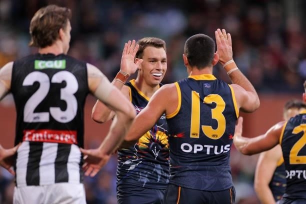 Riley Thilthorpe of the Crows and Taylor Walker of the Crows celebrate during the round 12 AFL match between the Adelaide Crows and the Collingwood...