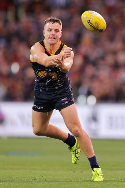 James Rowe of the Crows handballs during the round 12 AFL match between the Adelaide Crows and the Collingwood Magpies at Adelaide Oval on June 05,...