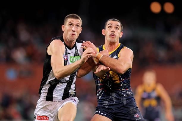 Darcy Cameron of the Magpies and Taylor Walker of the Crows compete for the ruck during the round 12 AFL match between the Adelaide Crows and the...