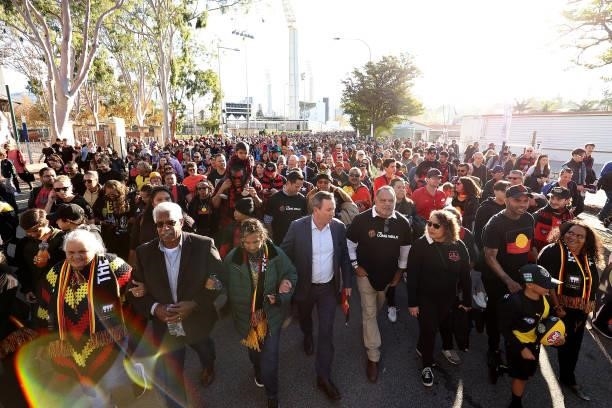 West Australian Premier Mark MGowan and Michael Long lead the Long Walk from the WACA to Optus Stadium during the round 12 AFL match between the...