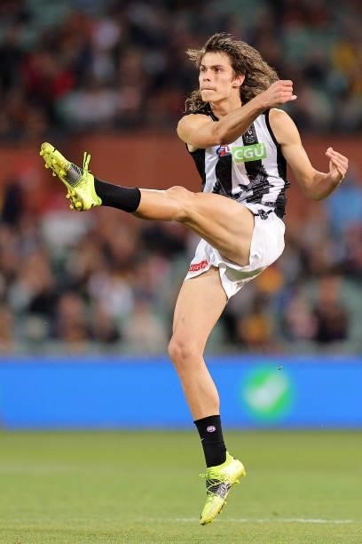Caleb Poulter of the Magpies kicks for goal during the round 12 AFL match between the Adelaide Crows and the Collingwood Magpies at Adelaide Oval on...