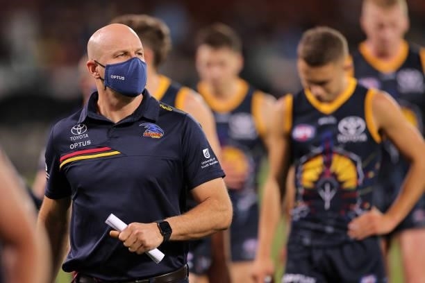 Matthew Nicks, head coach of the Crows walks from the ground during the round 12 AFL match between the Adelaide Crows and the Collingwood Magpies at...