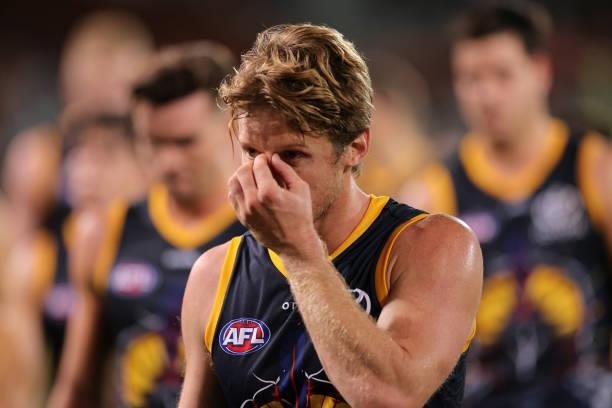 Rory Sloane of the Crows walks from the ground looking dejected during the round 12 AFL match between the Adelaide Crows and the Collingwood Magpies...