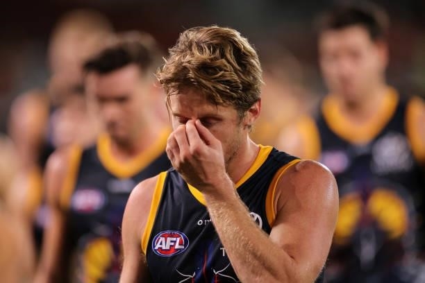 Rory Sloane of the Crows walks from the ground looking dejected during the round 12 AFL match between the Adelaide Crows and the Collingwood Magpies...