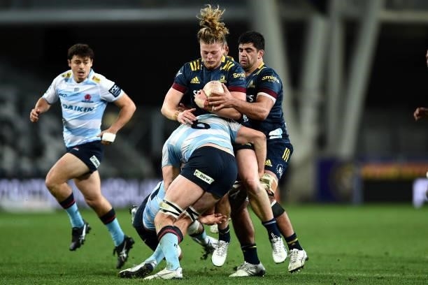 Scott Gregory of the Highlanders runs into the defence during the round four Super Rugby Trans-Tasman match between the Highlanders and the NSW...
