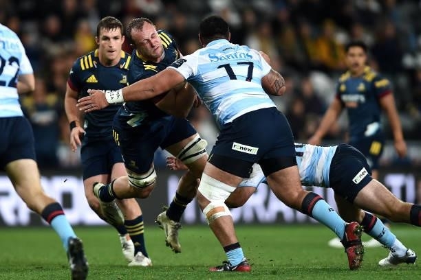 Hugh Renton of the Highlanders is tackled during the round four Super Rugby Trans-Tasman match between the Highlanders and the NSW Waratahs at...