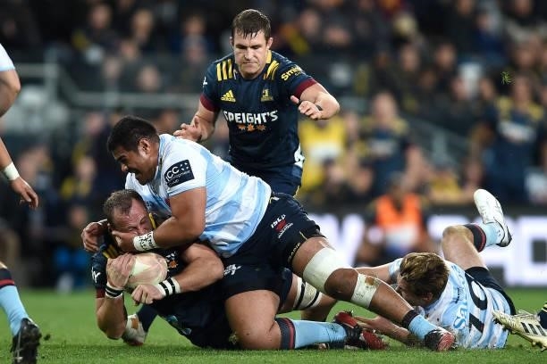 Hugh Renton of the Highlanders is tackled during the round four Super Rugby Trans-Tasman match between the Highlanders and the NSW Waratahs at...