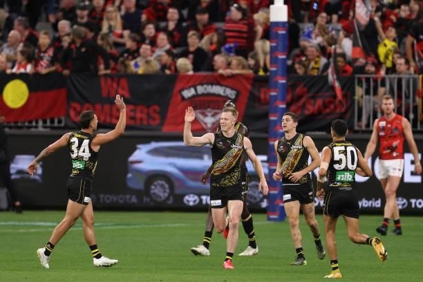 Jack Riewoldt of the Tigers celebrates a goal during the round 12 AFL match between the Essendon Bombers and the Richmond Tigers at Optus Stadium on...