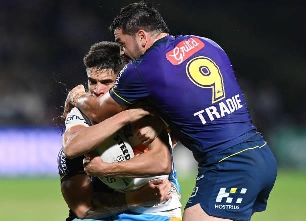 Jayden Campbell of the Titans is tackled by Brandon Smith of the Storm during the round 13 NRL match between the Melbourne Storm and the Gold Coast...