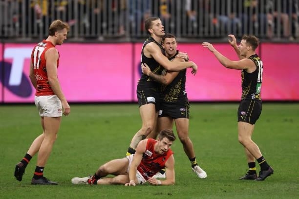 Callum Coleman-Jones of the Tigers and Jack Graham of the Tigers celebrates a goal during the round 12 AFL match between the Essendon Bombers and the...