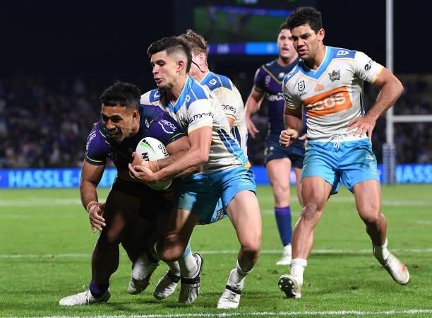 George Jennings of the Storm breaks away to score during the round 13 NRL match between the Melbourne Storm and the Gold Coast Titans at Sunshine...