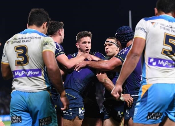 George Jennings of the Storm celebrates after scoring a try during the round 13 NRL match between the Melbourne Storm and the Gold Coast Titans at...