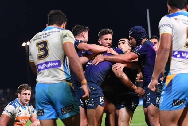 George Jennings of the Storm celebrates after scoring a try during the round 13 NRL match between the Melbourne Storm and the Gold Coast Titans at...