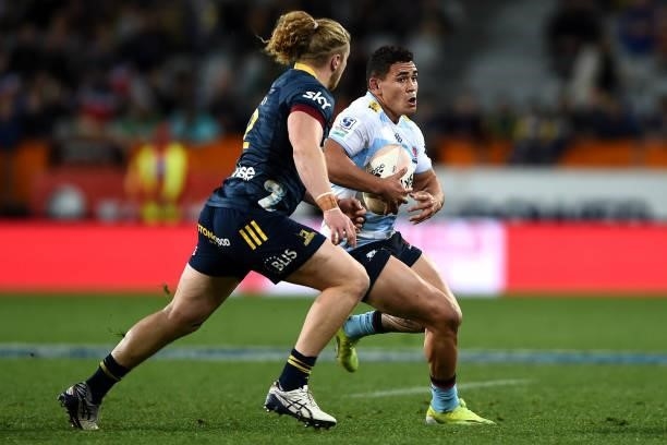 Izaia Perese of the Waratahs looks for a gap in the defence during the round four Super Rugby Trans-Tasman match between the Highlanders and the NSW...