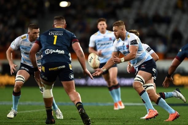 Jack Whetton of the Waratahs passes the ball during the round four Super Rugby Trans-Tasman match between the Highlanders and the NSW Waratahs at...