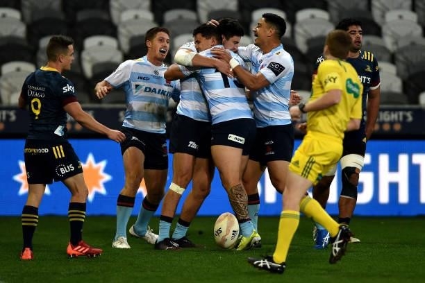 The Waratahs celebrate a try scored by Jack Maddocks during the round four Super Rugby Trans-Tasman match between the Highlanders and the NSW...
