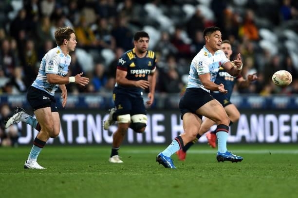Lalakai Foketi of the Waratahs passes the ball during the round four Super Rugby Trans-Tasman match between the Highlanders and the NSW Waratahs at...