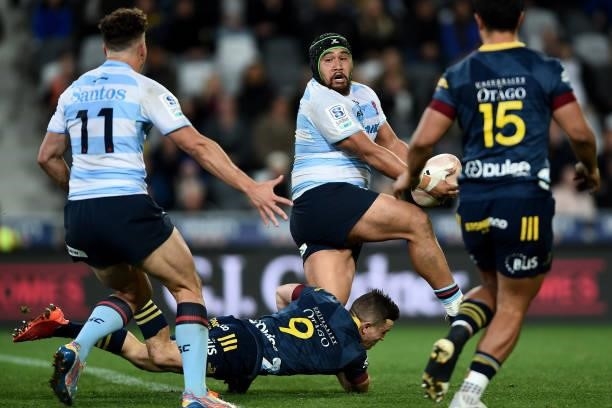 Andrew Tuala of the Waratahs looks to offload during the round four Super Rugby Trans-Tasman match between the Highlanders and the NSW Waratahs at...