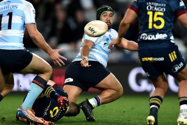 Andrew Tuala of the Waratahs offloads the ball during the round four Super Rugby Trans-Tasman match between the Highlanders and the NSW Waratahs at...
