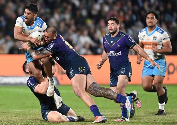 Tyrone Peachey of the Titans is tackled during the round 13 NRL match between the Melbourne Storm and the Gold Coast Titans at Sunshine Coast...