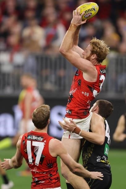 Andrew Phillips of the Bombers marks the ball during the round 12 AFL match between the Essendon Bombers and the Richmond Tigers at Optus Stadium on...