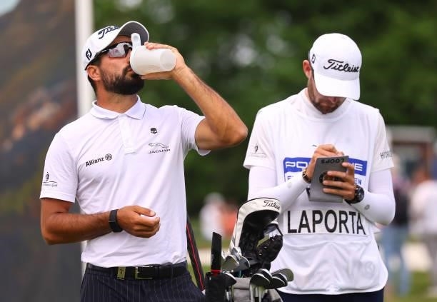 Francesco Laporta of Italy takes a drink on the on the fifth hole during the first round of the Porsche European Open at Green Eagle Golf Course on...