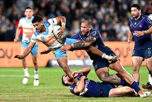 Tyrone Peachey of the Titans is tackled during the round 13 NRL match between the Melbourne Storm and the Gold Coast Titans at Sunshine Coast...