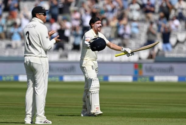 Rory Burns of England celebrates reaching his century as Ross Taylor of New Zealand applauds during Day 4 of the First LV= Insurance Test Match...