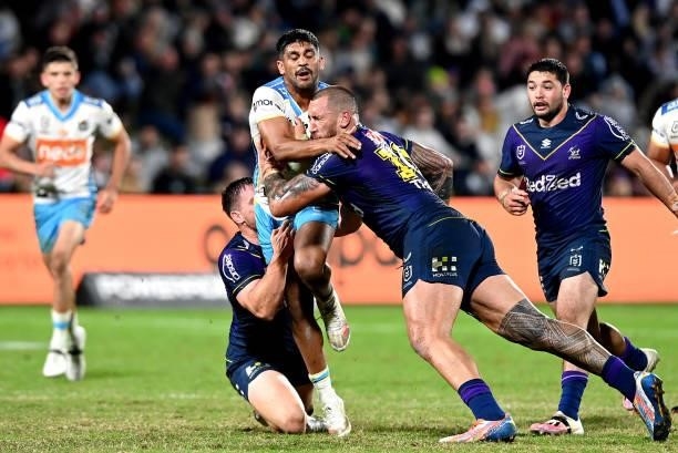 Tyrone Peachey of the Titans takes on the defence during the round 13 NRL match between the Melbourne Storm and the Gold Coast Titans at Sunshine...