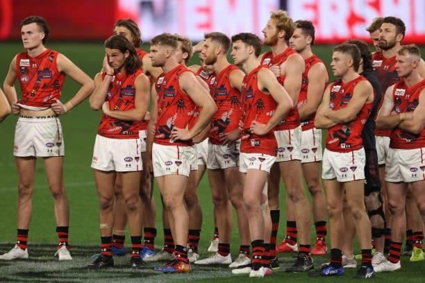 The Bombers look on after being defeated during the round 12 AFL match between the Essendon Bombers and the Richmond Tigers at Optus Stadium on June...