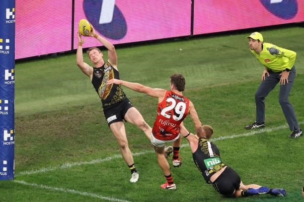 Dylan Grimes of the Tigers marks on the goal line to save a goal during the round 12 AFL match between the Essendon Bombers and the Richmond Tigers...